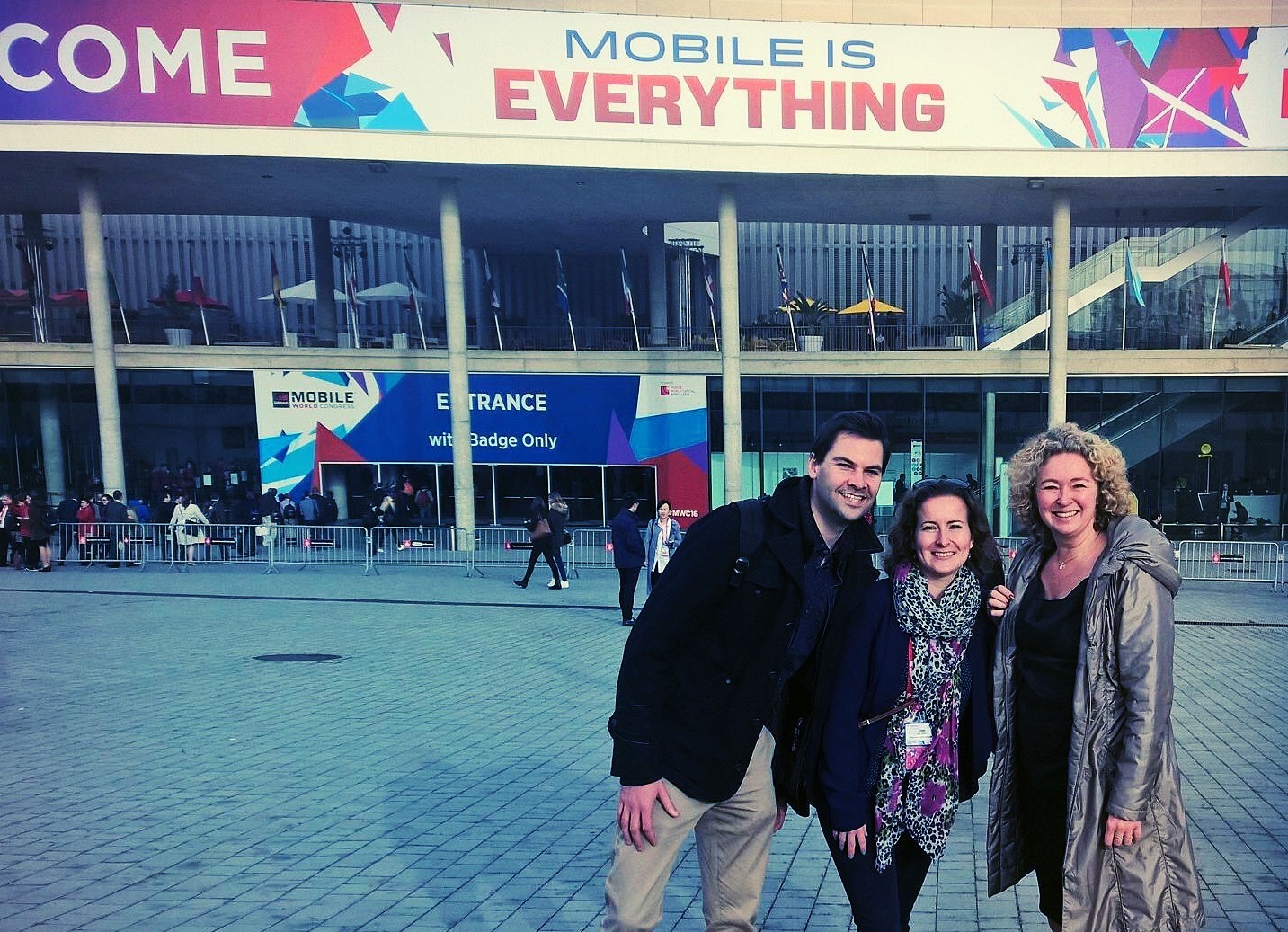 Three visitors outside Mobile World Congress 2016